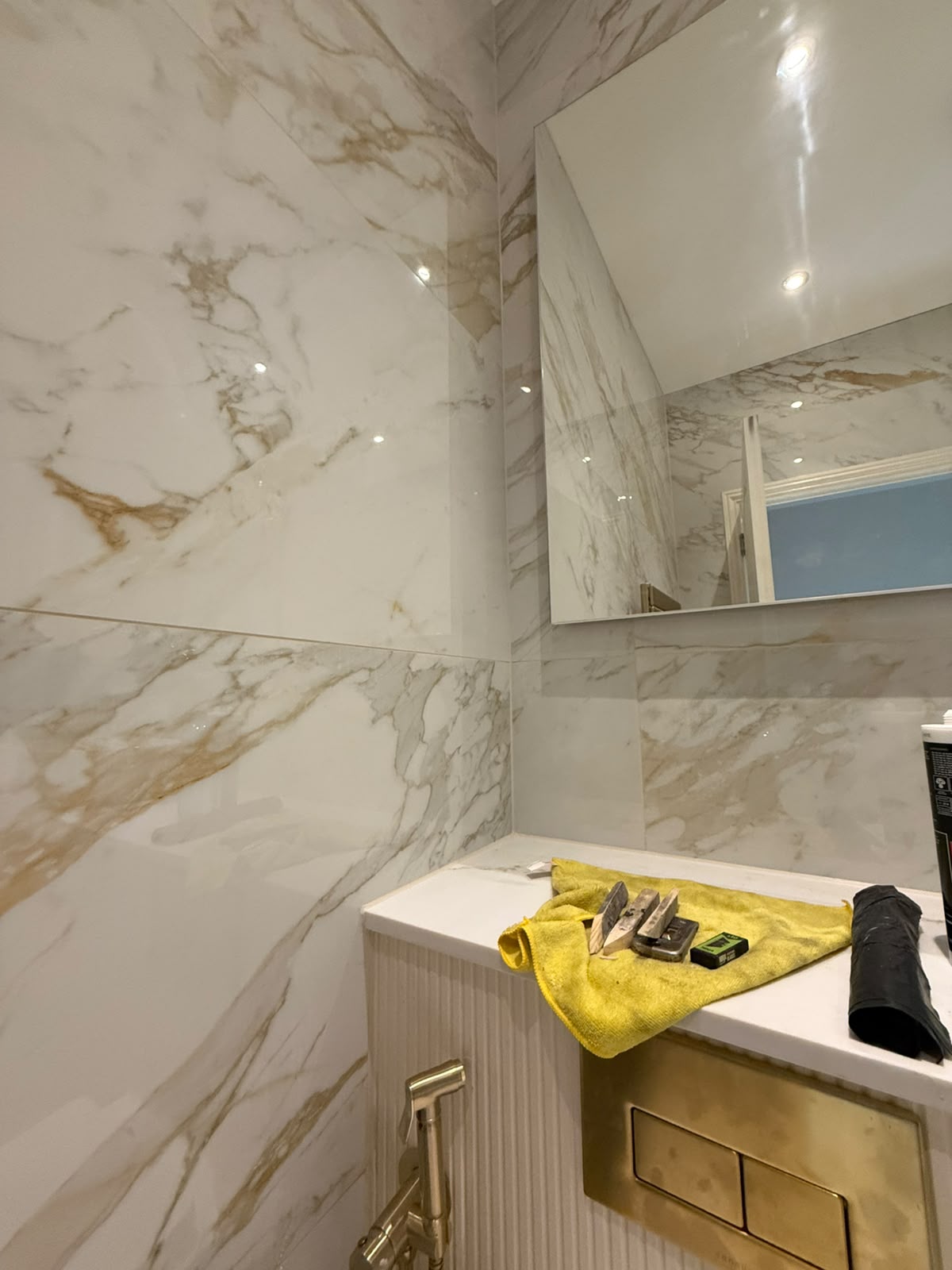 Marble cloakroom sealing work in progress by Blackline Mastic