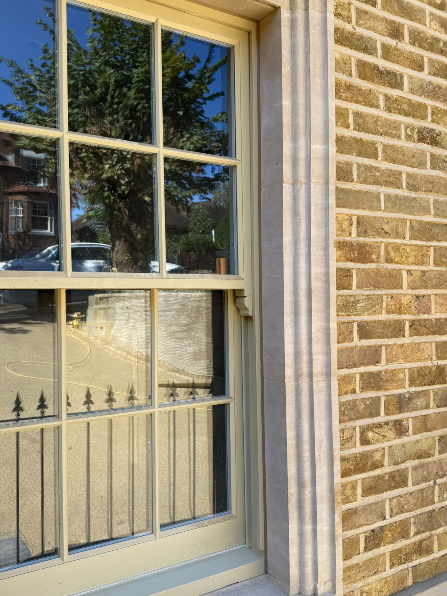 Exterior sash window frame and sill sealed by Blackline Mastic